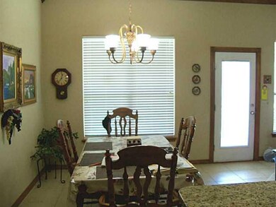 Exterior Front. Great dining area directly off kitchen with direct access to covered porch outside.