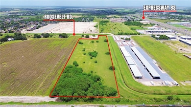 Aerial view of property and surrounding area featuring property parcel outlined