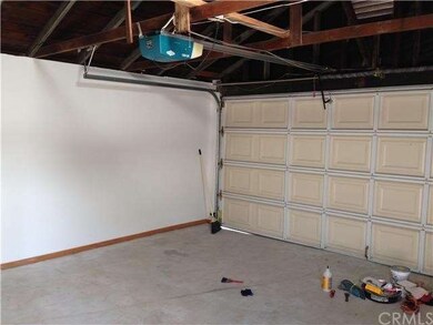 Inside double garage with garage door opener and d
