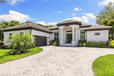 View of front of property with stucco siding, an attached garage, and decorative driveway