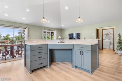 Large tiered island with inset cooktop