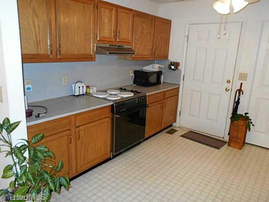 Kitchen. Access the driveway from this side door - easy to groceries from the car!
