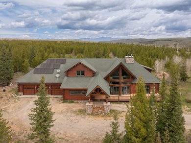 View of subject property featuring a heavily woode