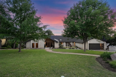 Mid-century modern home with a front lawn, french