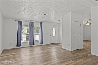 Living Room with entrance to Den