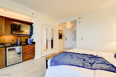 Bedroom featuring ornamental molding, french doors