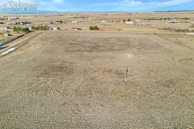 Drone / aerial view featuring a desert view, a mou