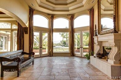 LOVELY FORMAL LIVING ROOM LOOKING OUT WITH PANORAM