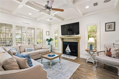 Fireplace in main living area, windows with planta