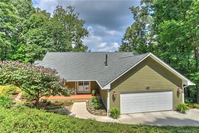 Front of home, featuring front patio, lush landsca