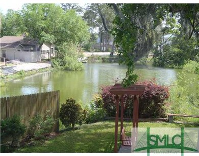 Land/Lot. The stocked pond wraps two sides of the 