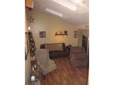 Taken from hallway upstairs, living room with vaul