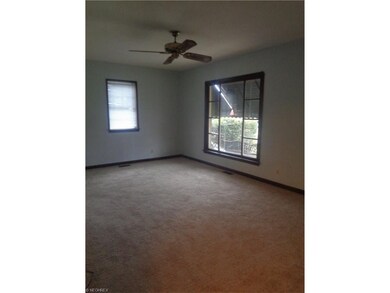 Living room.  Notice the beautiful details in the large front picture window.
