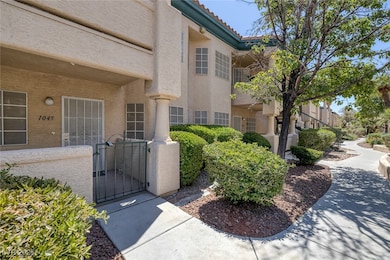 Property entrance with stucco siding, a tile roof,