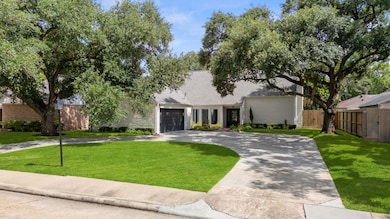 Double car driveway with a unique circle driveway.