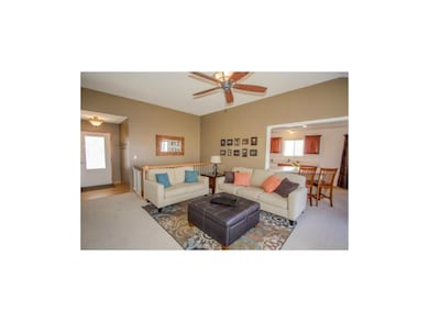 Living room opens into kitchen & dining room.