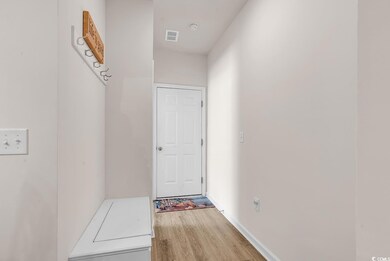Corridor featuring hardwood / wood-style floors