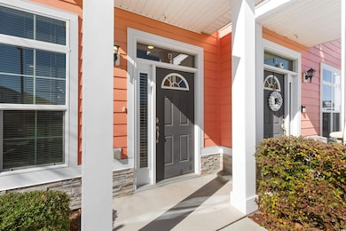 Property entrance with covered porch