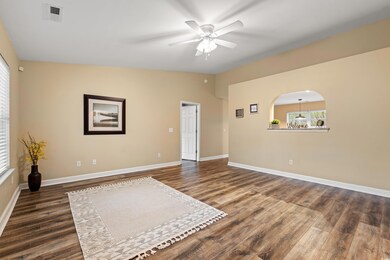 Unfurnished room with lofted ceiling, dark wood-ty
