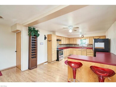 Kitchen featuring stainless steel electric range, 