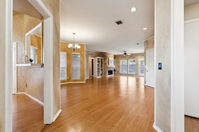Welcome home! Notice the open flow between the dining space and living room. Laminate flooring runs throughout most of the home.