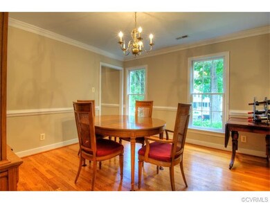 Elegant formal dining room with hardwood floors, c
