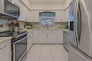 Beautifully updated kitchen with Corian counter to
