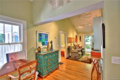 Entry from side porch into dining and den.