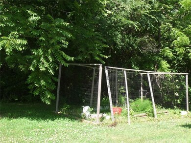 A garden area to the side of the house that needs a little TLC.