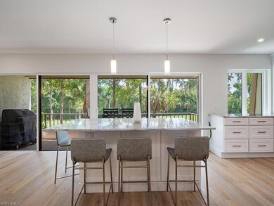Kitchen featuring a center island, decorative ligh