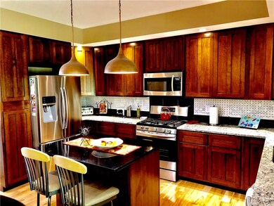A view of the kitchen from the dining room.  Don't you love the breakfast bar?