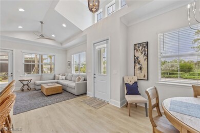 Living room with light hardwood / wood-style floor