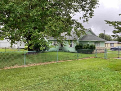 The property is entirely fenced in with a chain li