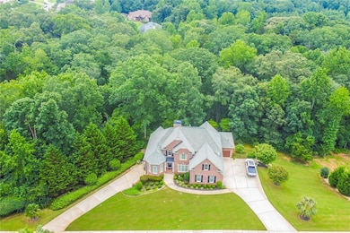 View from above of property with a forest