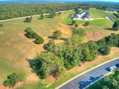 4 acres with mature oak trees.