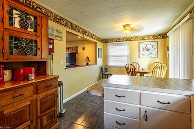 View from kitchen into dining room and open window