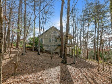 Right side of home showing large level lot.