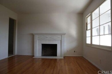 living room with hardwood flooring, fireplace, and
