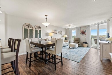 Dining space featuring ceiling fan and dark wood-t