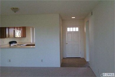 Living Room towards kitchen and entry