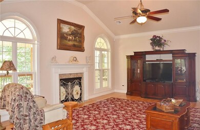 Large living room on main floor with fireplace.