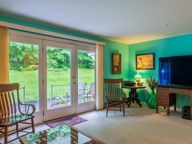 Living room with large windows to patio