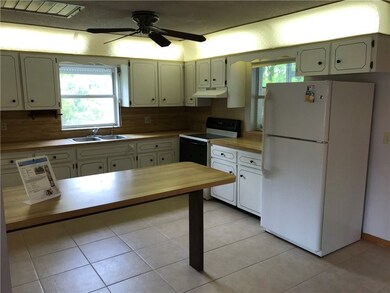 Plenty of cabinets, appliances stay. Two windows f