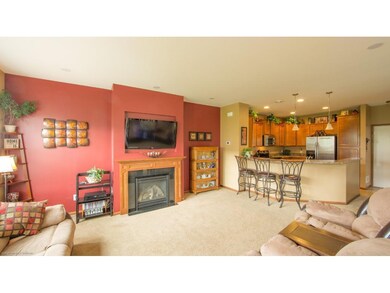 Main floor living room with gas fireplace; open co