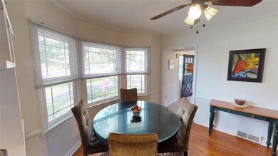 FORMAL DINING ROOM W/BAY WINDOWS.