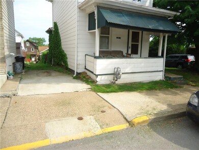 Alley runs along side of house.