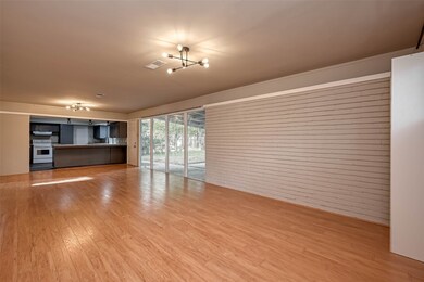 This light and bright den/dining combo room overlo