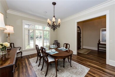 Dining room w/10' ceilings and plantation shutters