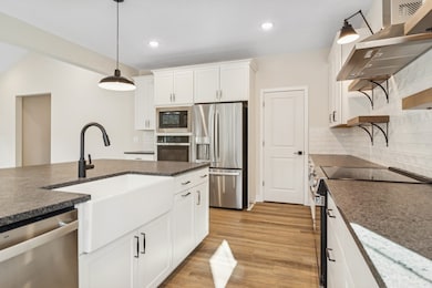 Kitchen with oversized island and apron-front sink