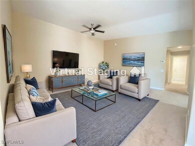 Living area featuring baseboards, carpet flooring,